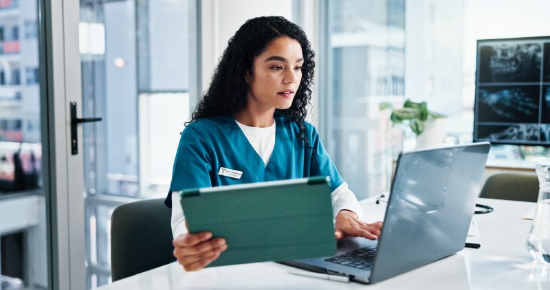 Woman, nurse or reading with laptop or tablet for medical research.